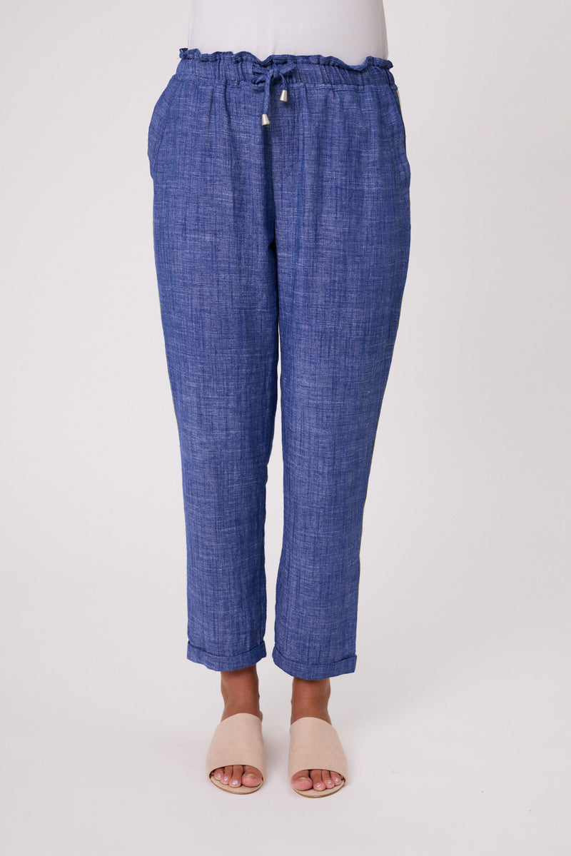Blue checkered pants worn by a person on a white background Venice Linen Pant Denim