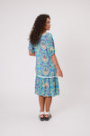 Woman wearing a blue patterned dress on a white background Salerno Printed Dress Aqua