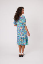 Woman wearing a blue patterned dress on a white background Salerno Printed Dress Aqua