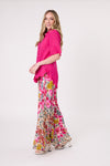 Woman wearing a bright pink top and floral pants on a white background
Camilla Linen Top Fuchsia