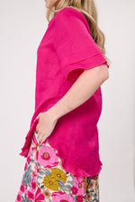 Person wearing a bright pink top and floral skirt against a white background
Camilla Linen Top Fuchsia