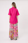 Person wearing a bright pink shirt and floral pants on a white background
Camilla Linen Top Fuchsia