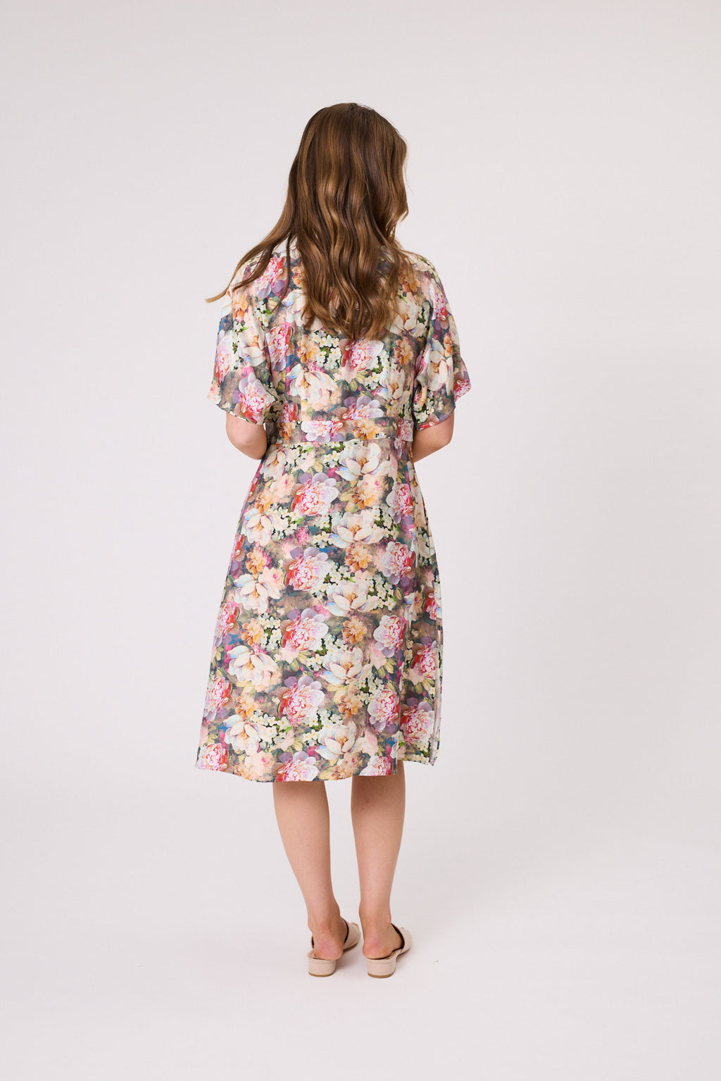 Woman wearing a floral dress on a white background Willow Dress Green Multi