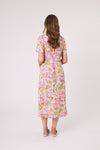 Woman wearing a floral dress on a white background Sadie Shirred Waist Dress Multi