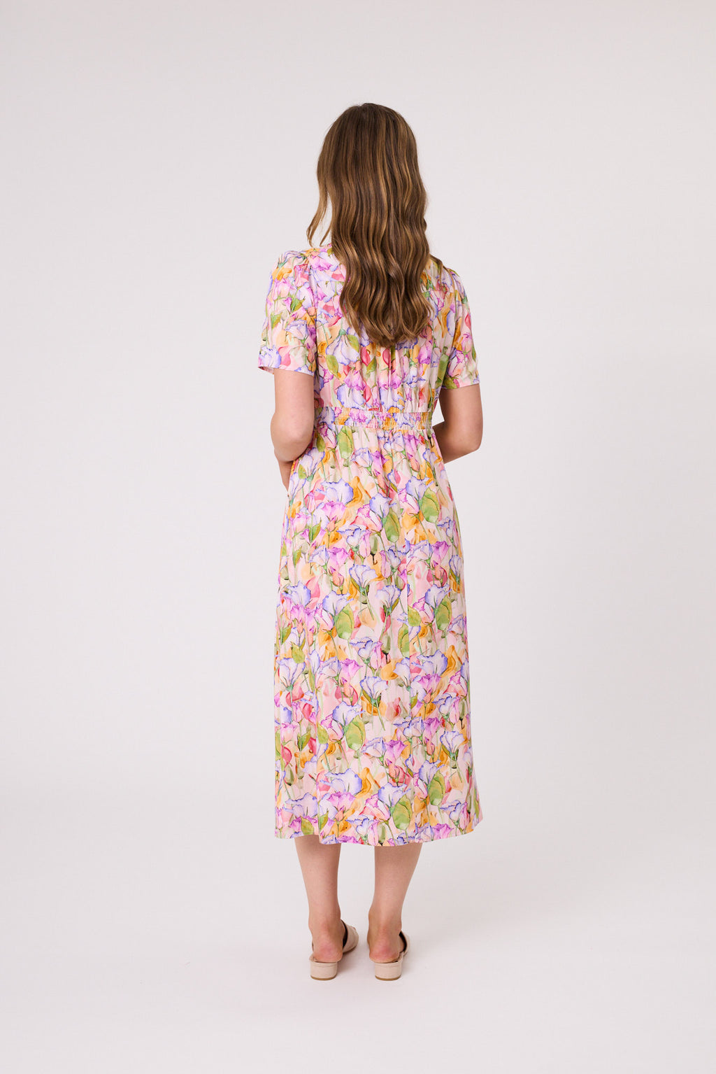 Woman wearing a floral dress on a white background Sadie Shirred Waist Dress Multi