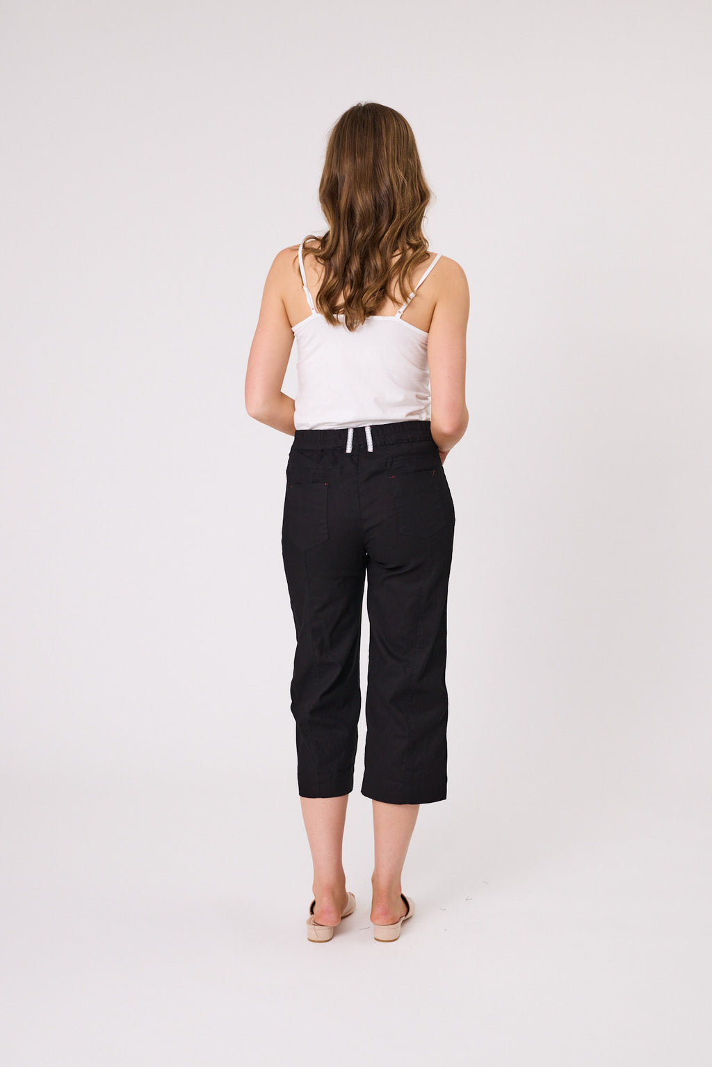 Woman wearing a white top and black capri pants on a white background Lily 3/4 Pants Black