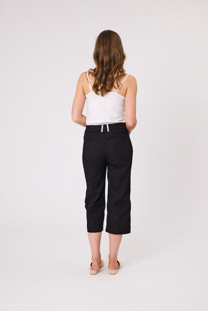 Woman wearing a white top and black capri pants on a white background Lily 3/4 Pants Black