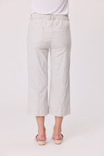 Light gray wide-leg pants worn by a person on a white background Lily 3/4 Pants Silver