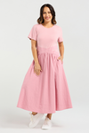 Woman wearing a pink dress on a white background
Delilah Dress Pink