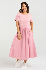 Woman wearing a pink dress on a white background
Delilah Dress Pink
