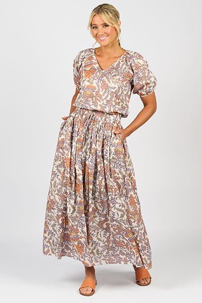 Woman wearing a patterned dress on a white background
Elastic Waist Maxi Skirt Tuscany
