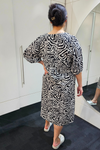 Person wearing a black and white patterned dress in a bathroom setting
Elastic Sleeve Dress Black/White