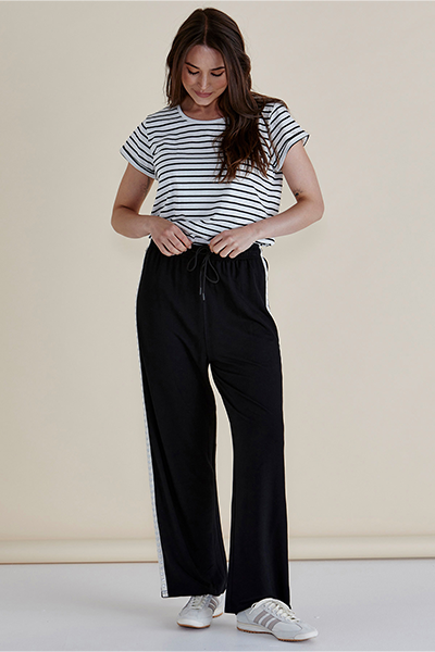 Woman wearing a striped shirt and black pants against a plain background
Evelyn Wide Leg Jogger Black