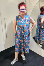 Woman in a colorful floral dress standing in front of a mirror.
Everly Dress Navy