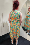 Person wearing a floral dress in front of a mirror
Everly Dress Green