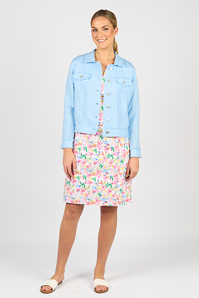 Woman wearing a light blue denim jacket over a floral dress on a white background
Frayed Linen Jacket Sky Blue