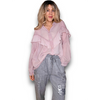 Woman wearing a pink blouse and gray pants on a white background
Frill Tunic Baby Pink