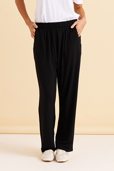 Person wearing black pants and a white shirt on a beige background
Ginnie Bamboo Pant Black