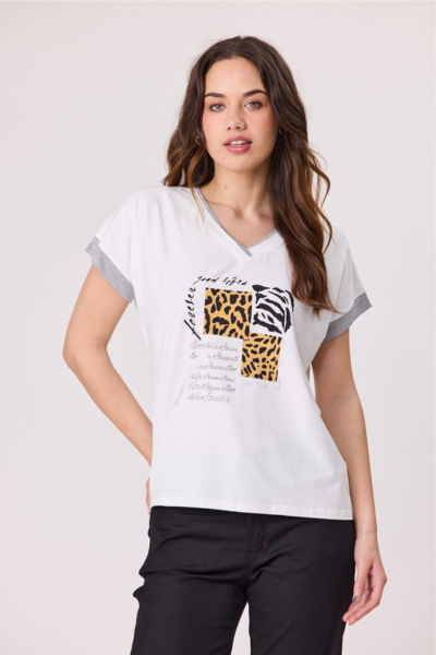 Woman wearing a white t-shirt with animal print designs on a plain background Good Life T-Shirt Ivory