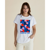 Woman wearing a white t-shirt with colorful floral design and 'Campo de Fiori' text on a beige background