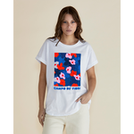 Woman wearing a white t-shirt with colorful floral design and 'Campo de Fiori' text on a beige background