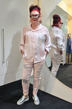 Person wearing a light-colored outfit with ripped jeans in front of a mirror.
Italian Hey Sequin Shirt Pink
