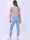 Woman wearing a gray tank top and light blue pants on a white background
Italian Magic Pants Denim Blue