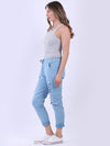 Woman wearing a gray tank top and light blue jeans on a white background
Italian Magic Pants Denim Blue