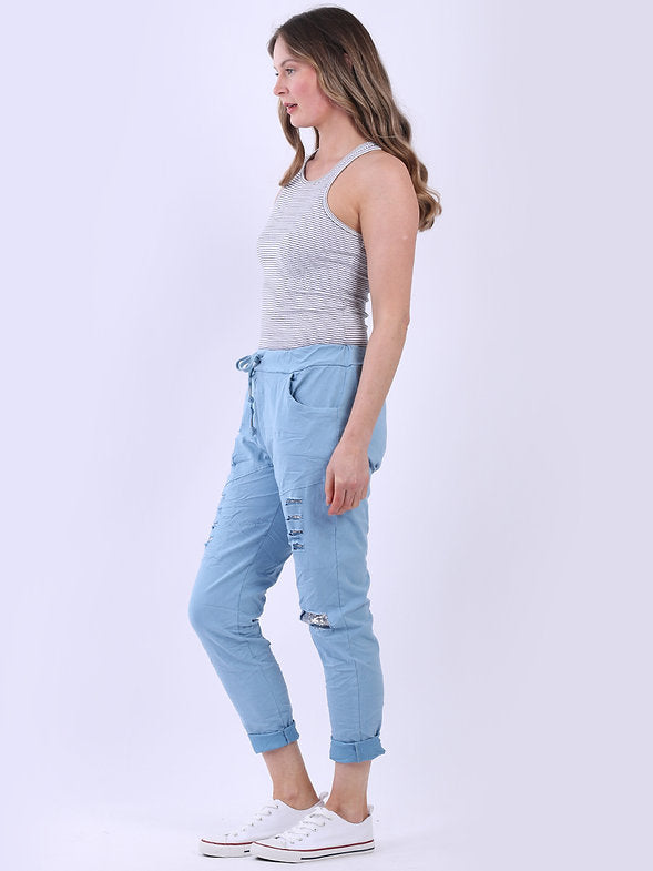 Woman wearing a gray tank top and light blue jeans on a white background
Italian Magic Pants Denim Blue