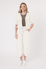Woman wearing a white outfit with a black and white striped top on a white background
Larissa Pant Antique White