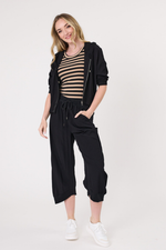 Woman wearing a black outfit with a striped top on a white background
Larissa Pant Black