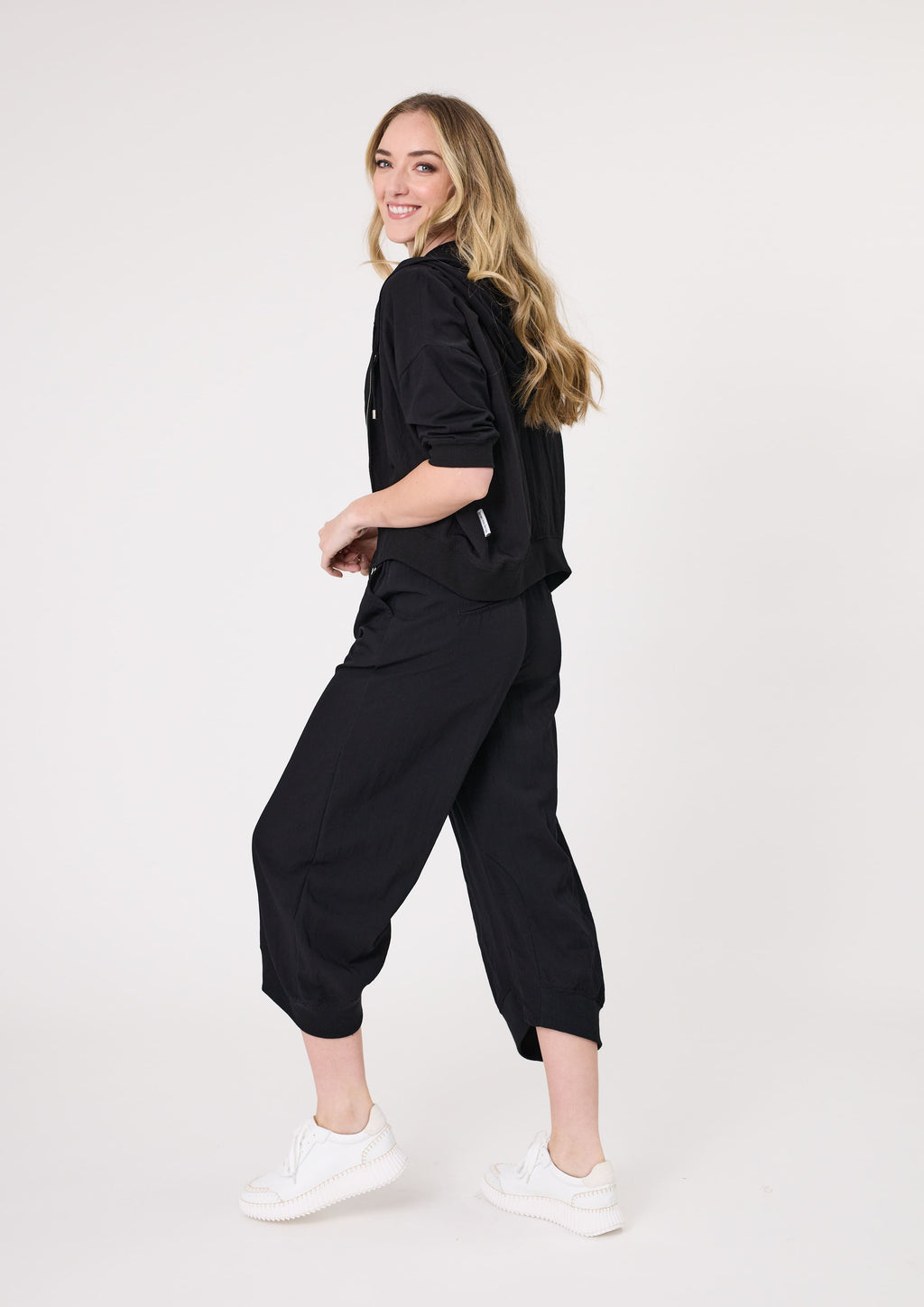 Woman wearing a black jumpsuit on a white background
Larissa Pant Black