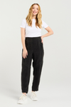 Woman wearing black pants and a white shirt on a white background
Lilith Pants Black
