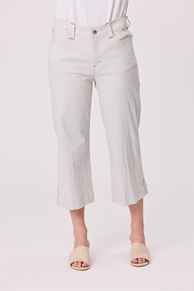 Light gray pants worn by a person on a white background Lily 3/4 Pants Silver