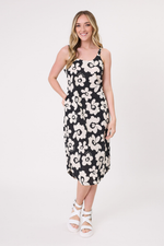 Woman wearing a black floral dress on a white background
Maddie Floral Dress Black/White