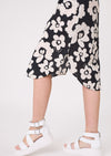 Black and white floral skirt worn by a person on a white background
Maddie Floral Dress Black/White