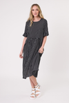 Woman wearing a black and white striped dress on a white background Madonna Dress Black/White Stripe