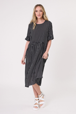 Woman wearing a black and white striped dress on a white background Madonna Dress Black/White Stripe