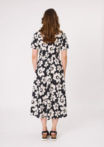Woman wearing a black floral dress on a white background Marta Floral Dress Black/White