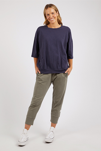 Woman wearing a navy blue top and green pants on a white background
Mazie Sweat Navy