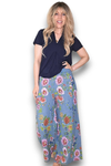 Woman wearing a navy top and floral pants on a white background Palazzo Doily Rose Pant Petrol