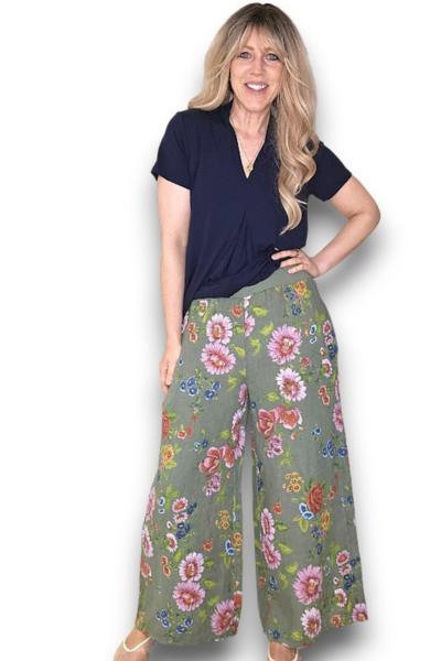 Woman wearing a navy top and floral wide-leg pants on a white background Palazzo Doily Rose Pant Forest