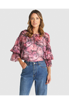 Woman wearing a floral blouse and blue jeans on a white background
Phenomenon Blouse Peony Pink