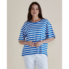 Woman wearing a blue and white striped shirt against a plain background