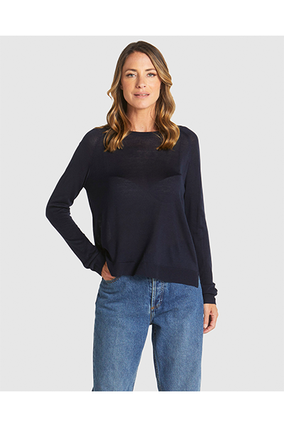 Woman wearing a navy sweater and blue jeans on a white background
Reminiscent Knit Navy