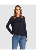 Woman wearing a navy sweater and blue jeans on a white background
Reminiscent Knit Navy