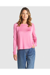 Woman wearing a pink long-sleeve top and blue jeans on a white background
Reminiscent Knit Pink