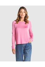 Woman wearing a pink long-sleeve top and blue jeans on a white background
Reminiscent Knit Pink
