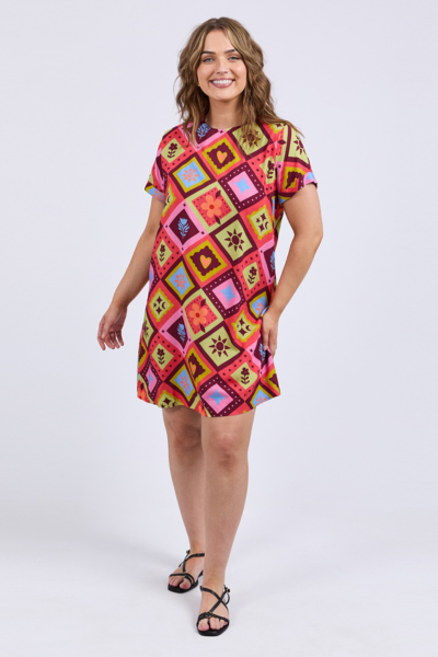 Woman wearing a colorful patterned dress on a white background
Rhode Dress Geo Print