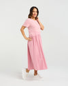 Woman wearing a pink dress on a white background
Delilah Dress Pink